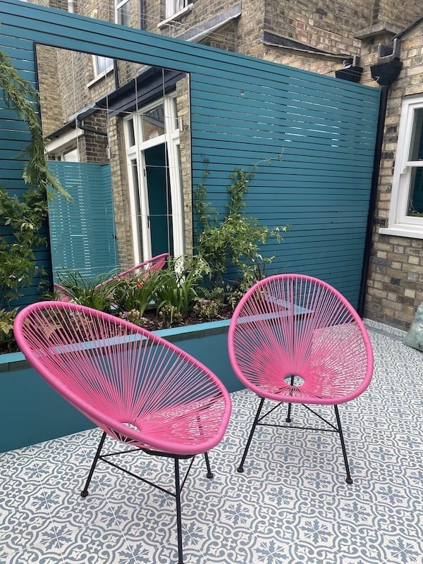 Chairs and contrast to landscaping in a london garden
